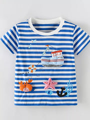 Flat lay front view of a children's blue and white striped short sleeve tee with boat and sea appliques