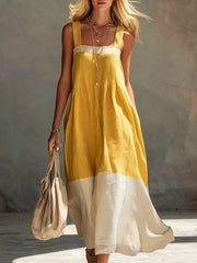 Front full length view on model of yellow color block sleeveless linen blend midi dress