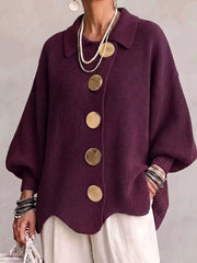 Front view of a burgundy knit cardigan with large gold buttons and lantern sleeves