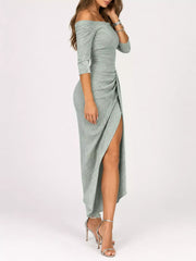 Sage green shimmering off shoulder ruched midi dress with thigh slit in a studio side view