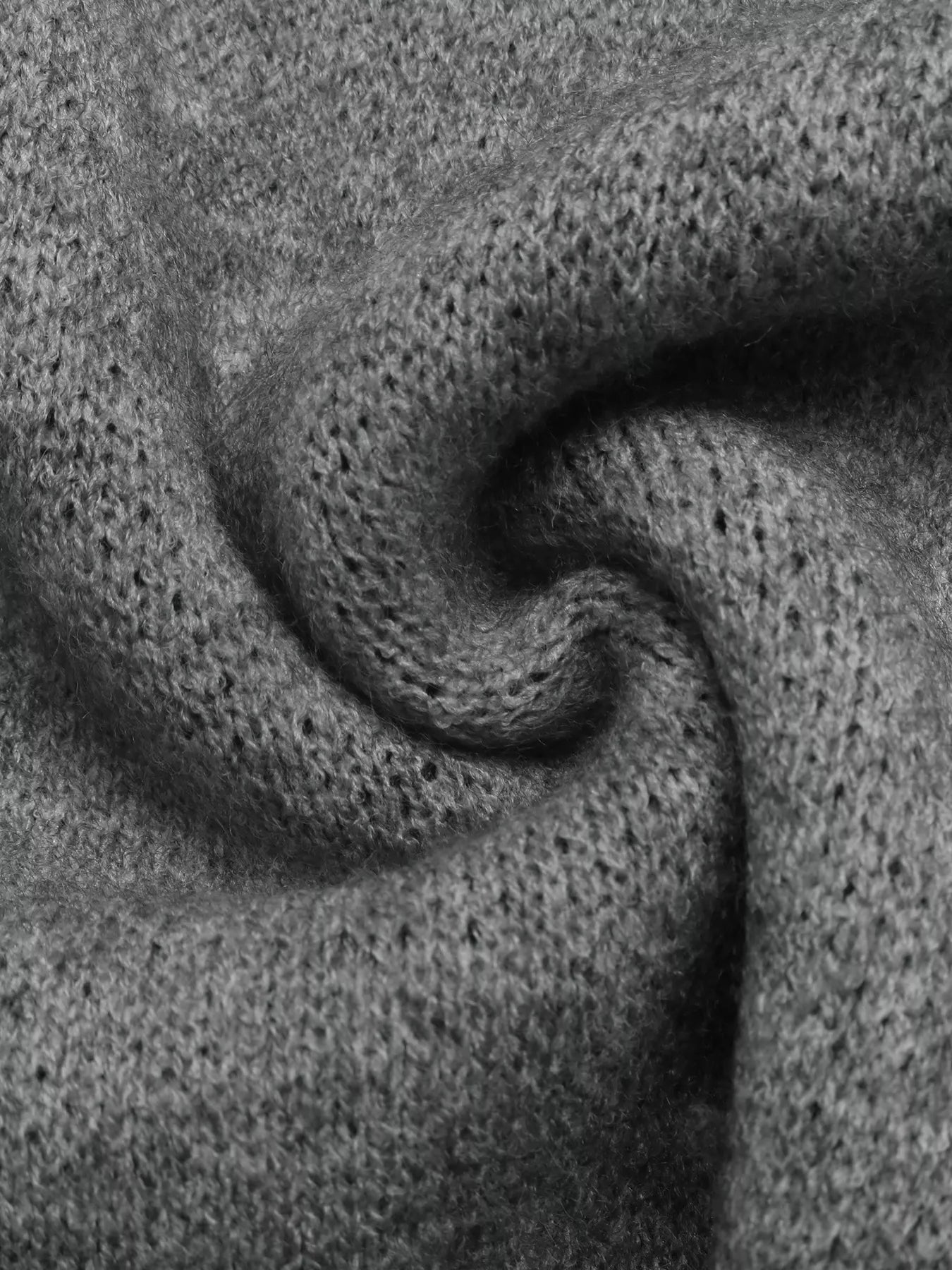 Close-up of soft gray knit fabric showing its fine textured weave
