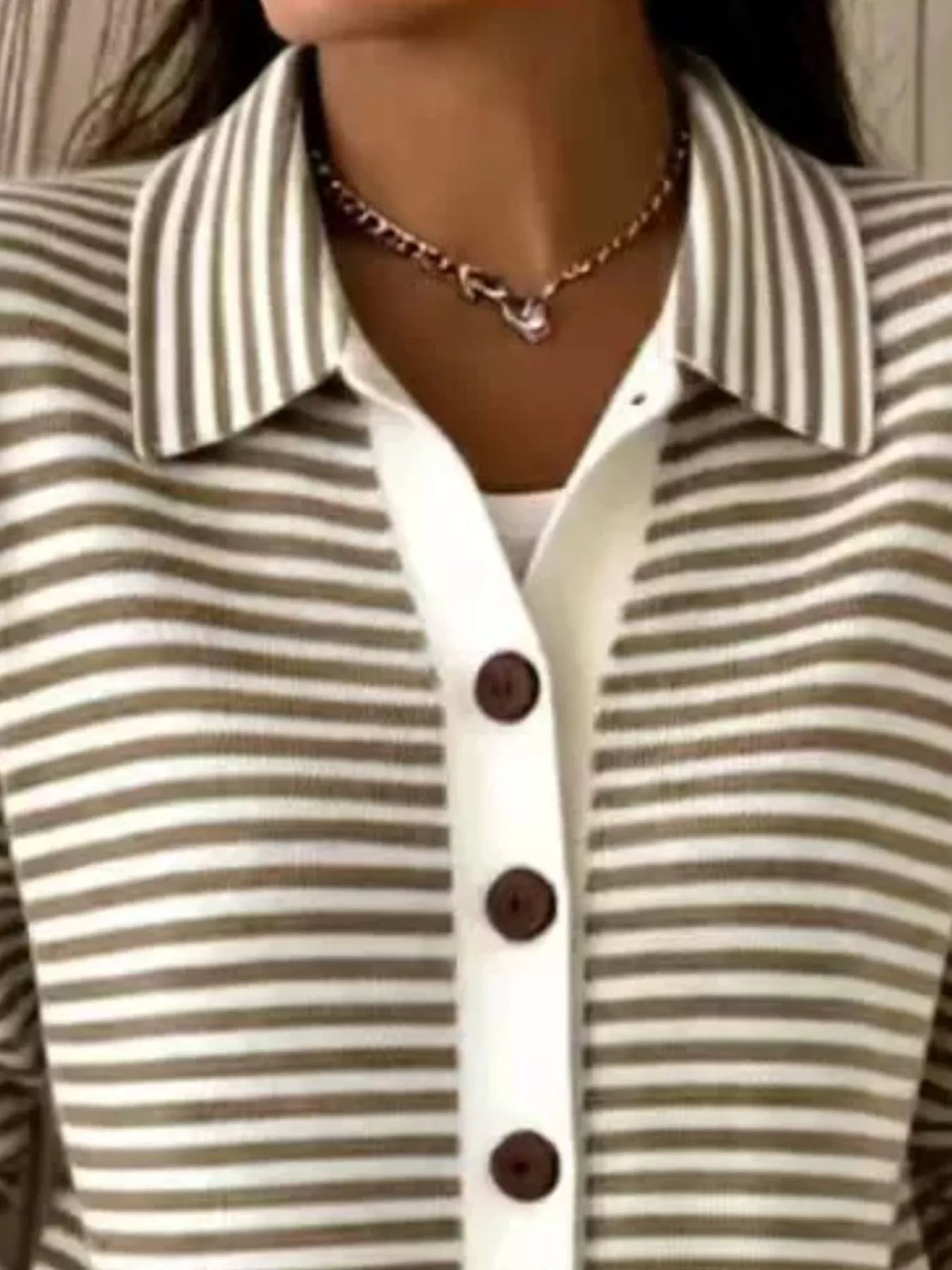 Close-up on-model view of khaki and white striped collared cardigan with brown buttons