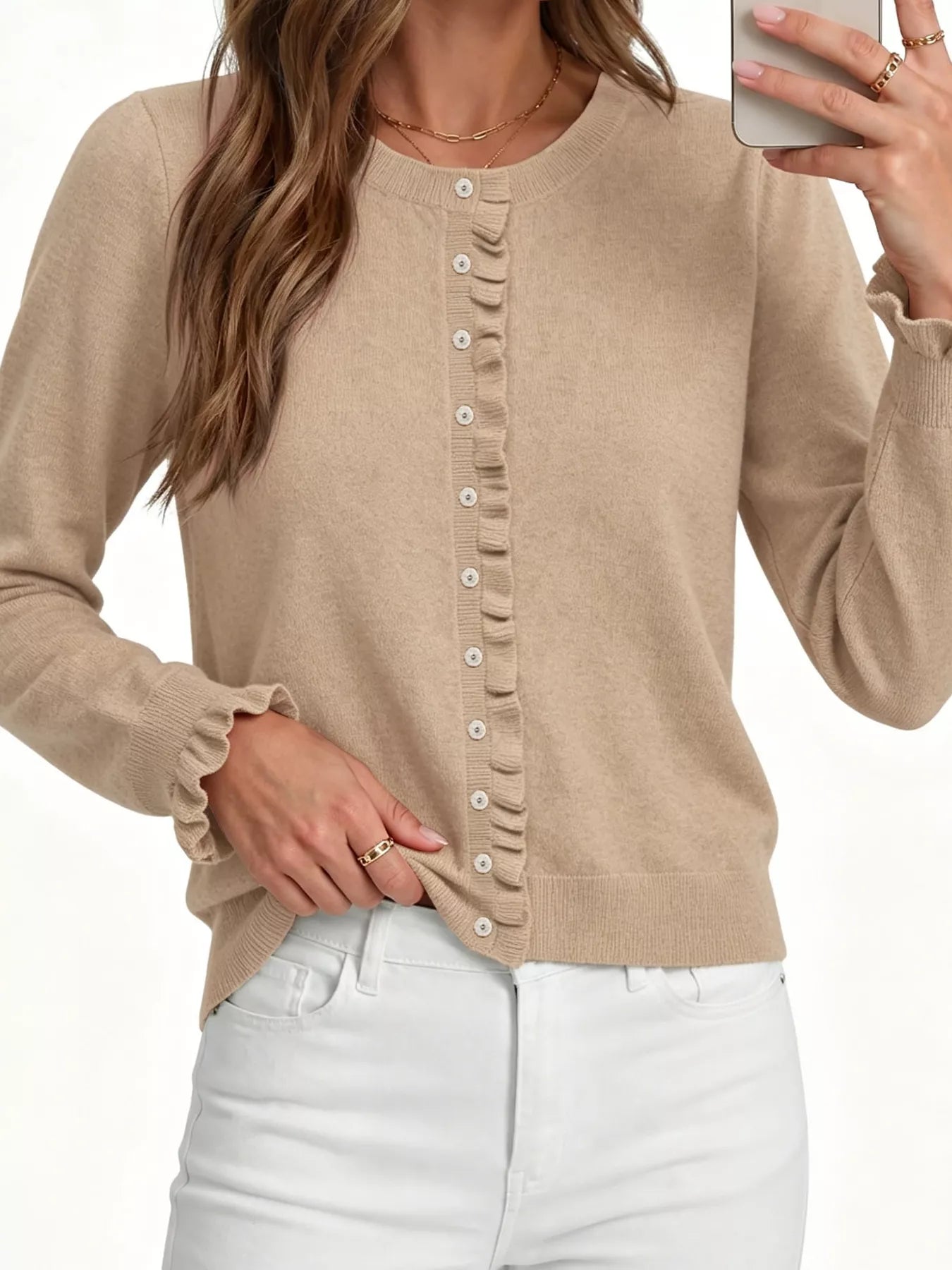 Close front view of khaki ruffle trimmed button down cardigan with white jeans on white background