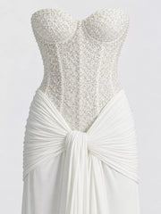 White strapless sequin corset bodice and knotted draped waist, close detail view