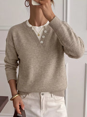 Mirror selfie view of khaki dropped shoulder sweater with V neck button placket