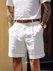 Men's white classic pleated shorts with pockets, available in plus sizes.