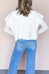 Back view of a white ribbed mock neck top layered over lace long sleeves