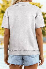 Back view of a light gray women’s short-sleeve T-shirt with ribbed collar and hem band.