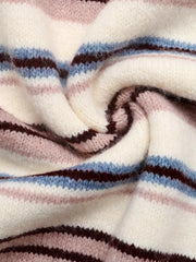 Close-up of soft striped knit fabric in cream, pink, blue, and burgundy