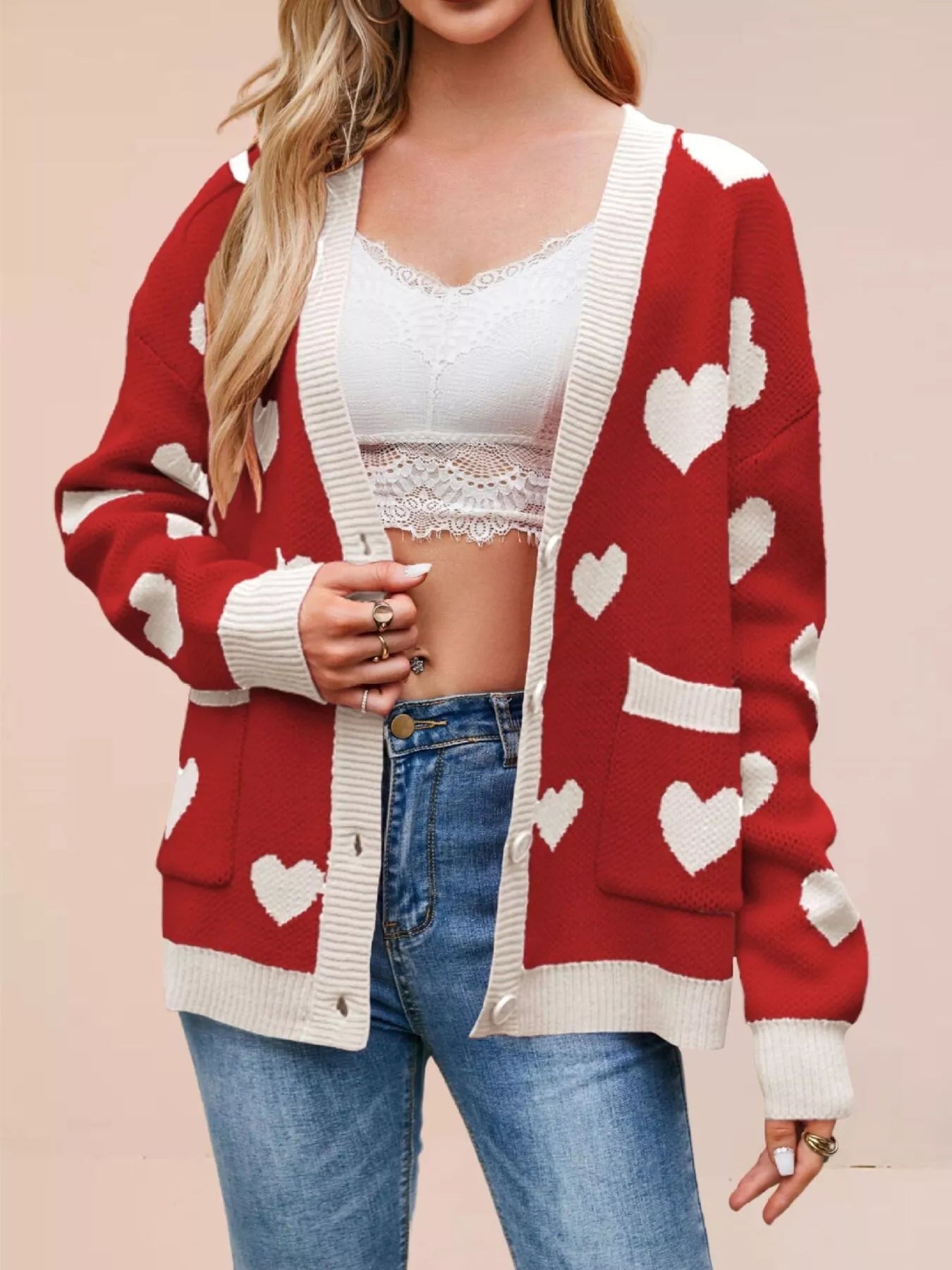 Red knit cardigan with white hearts and cream trim worn open