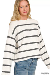 White wool blend striped sweater with charcoal stripes worn with light jeans
