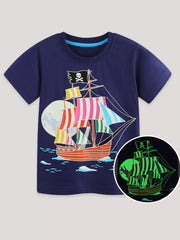 Front view of the dark navy children's t-shirt with striped pirate ship and glow-in-the-dark inset detail