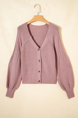 Flat lay front view of a dusty pink V-neck button-down cardigan on a hanger