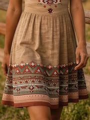 Close view of khaki tribal print dress skirt with patterned border hem