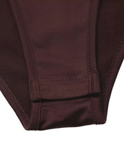 Close-up of the coffee brown bodysuit solid bottom closure and stitching