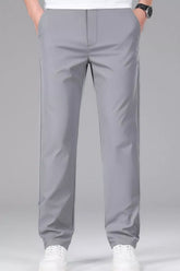 Men's gray slim-fit stretch dress pants with pockets.