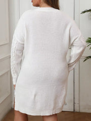 Back view of white cable knit sweater dress with long sleeves and ribbed hem