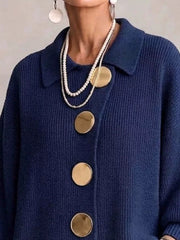 Close up of the navy cardigan collar and large gold front buttons