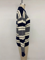 Side view of the striped polo sweater displayed on a mannequin