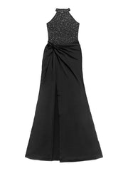 Black sleeveless maxi dress laid flat showing rhinestone halter bodice twisted waist and front slit