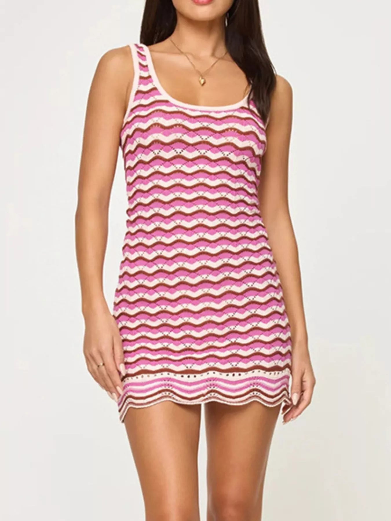 Studio front view of a pink, cream and brown openwork chevron knit tank dress