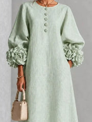 Sage round neck midi dress with balloon sleeves, floral cuffs and small floral buttons, front view