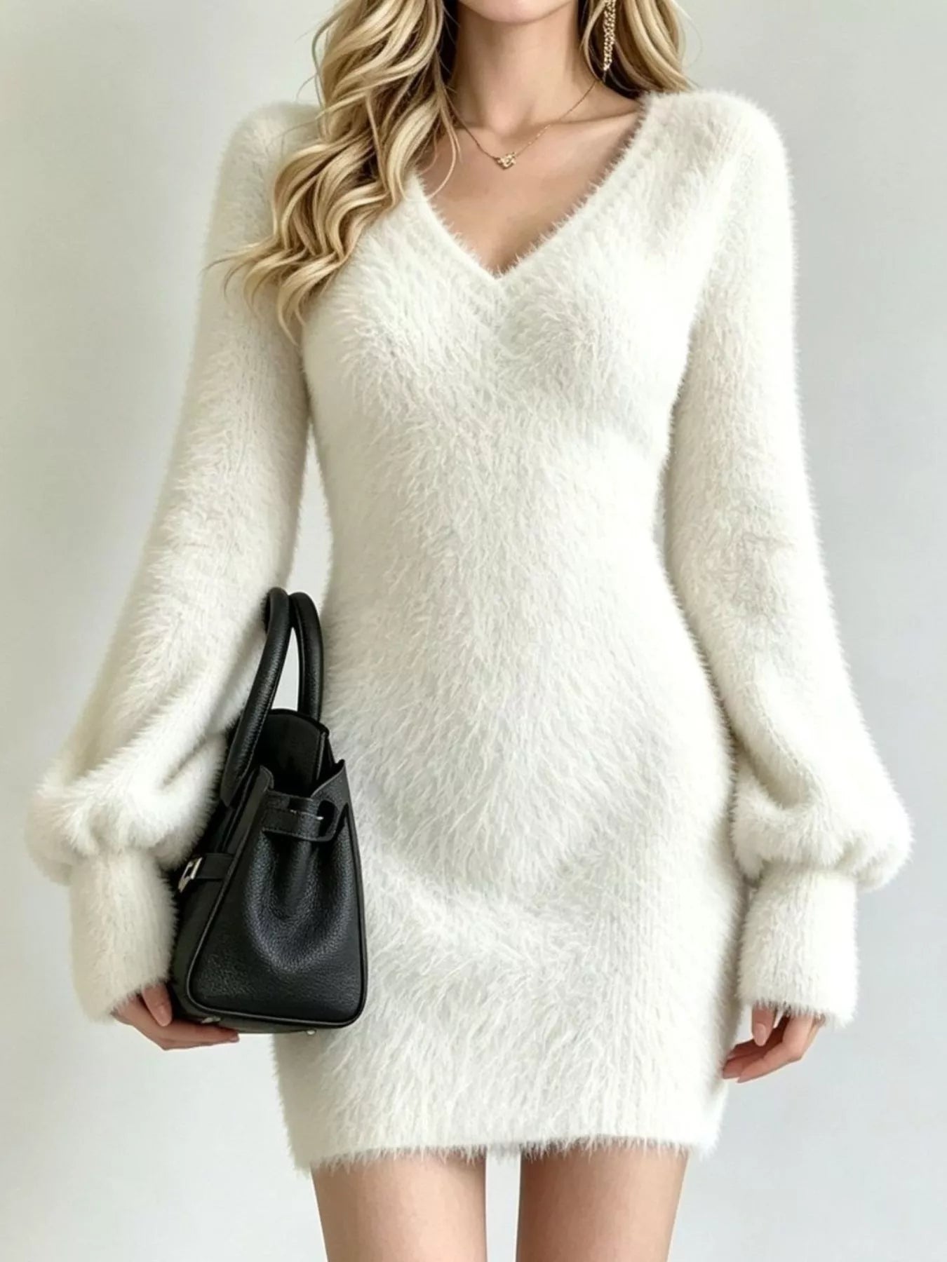 White fuzzy knit sweater dress with V neck and long puff sleeves, front view