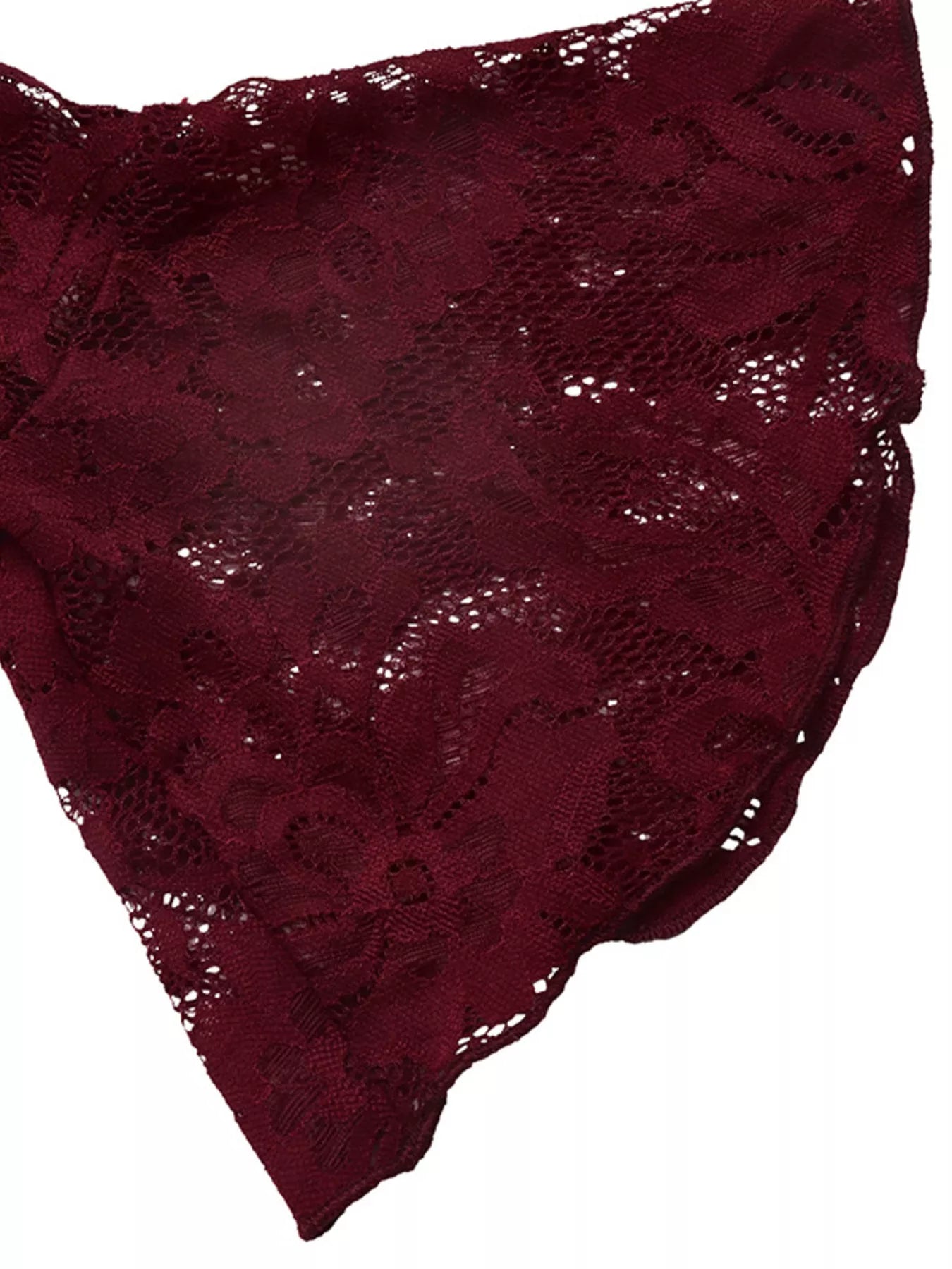 Close view of burgundy floral lace fabric from the flared sleeve of mini dress