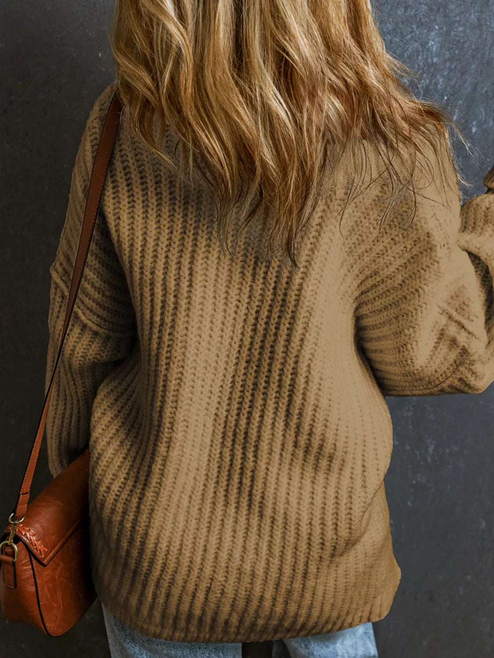Back view of taupe slouchy chunky ribbed knit sweater with long sleeves.