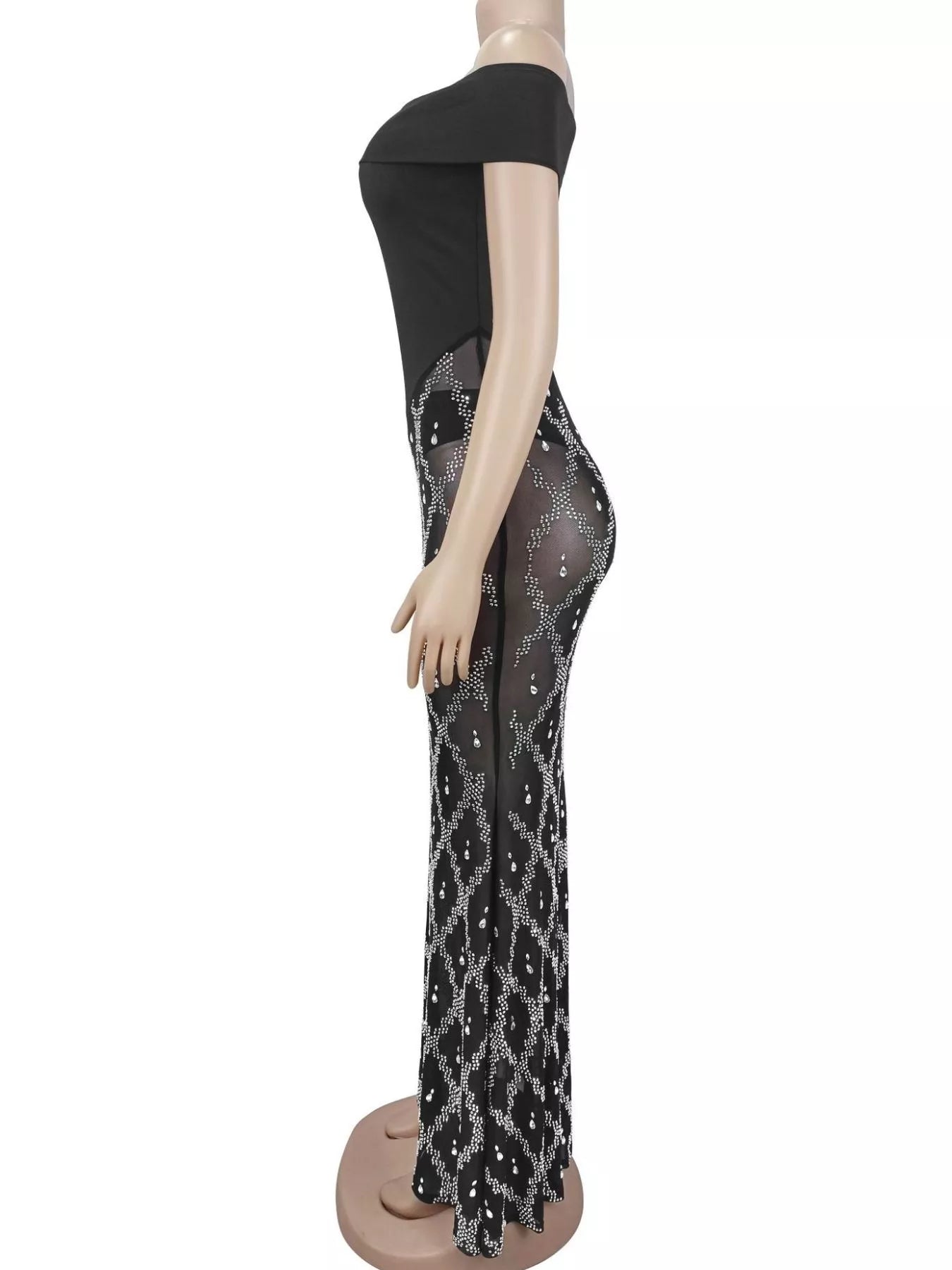 Side view of black off shoulder maxi dress with sheer rhinestone skirt on a mannequin