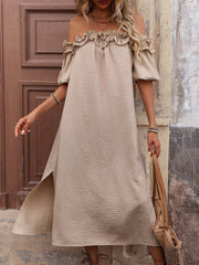 Women's tan ruffled off-shoulder midi dress with puff sleeves and side slit, front view on model with a woven bag.