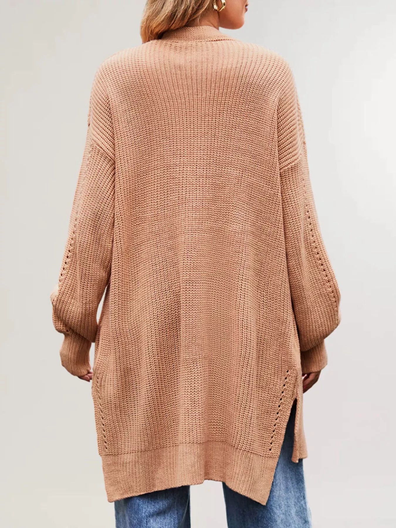 Back view of the apricot long open front cardigan with openwork sleeves