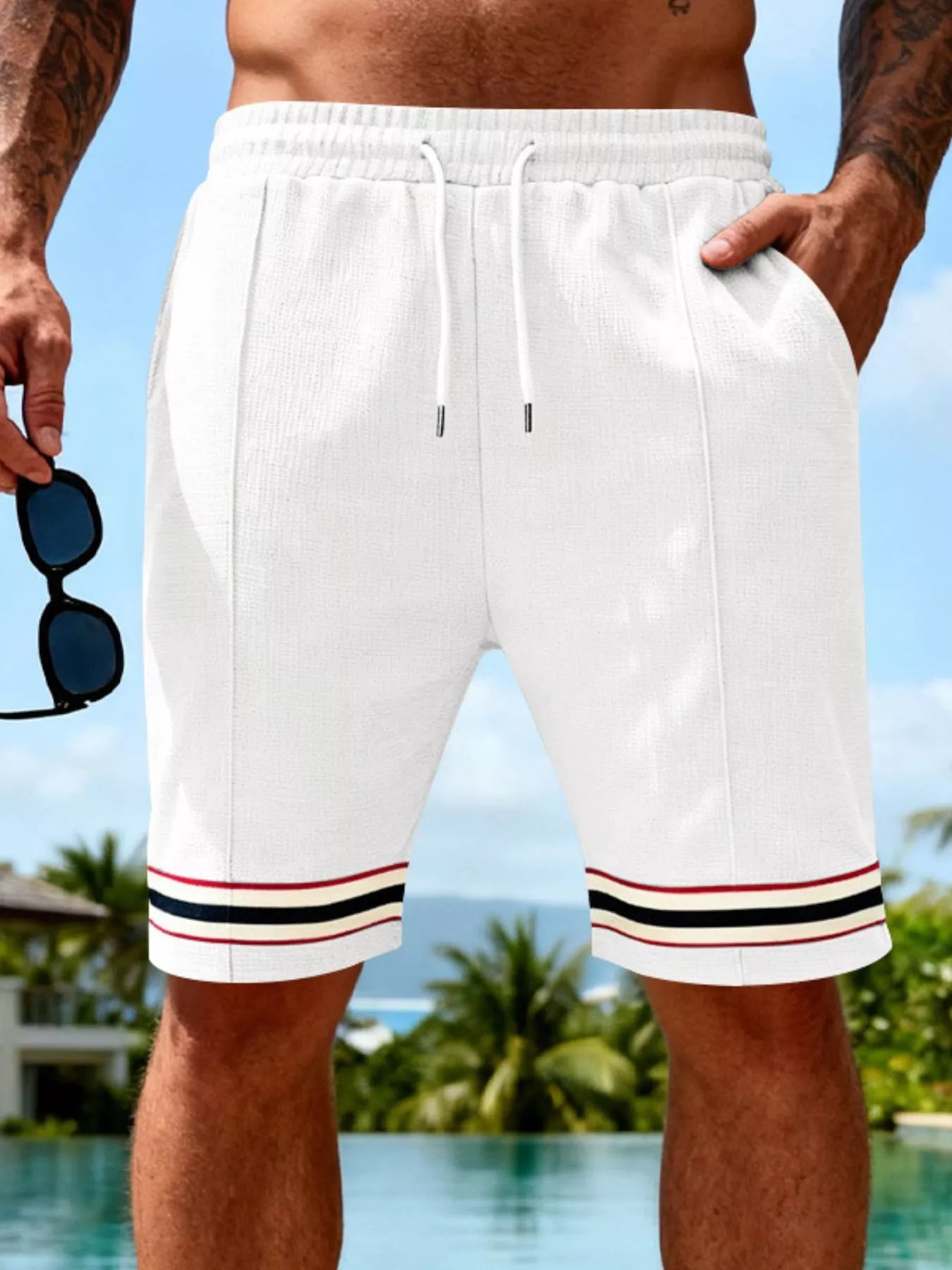 Men's gray and white textured knit shorts with a drawstring waist and pockets.