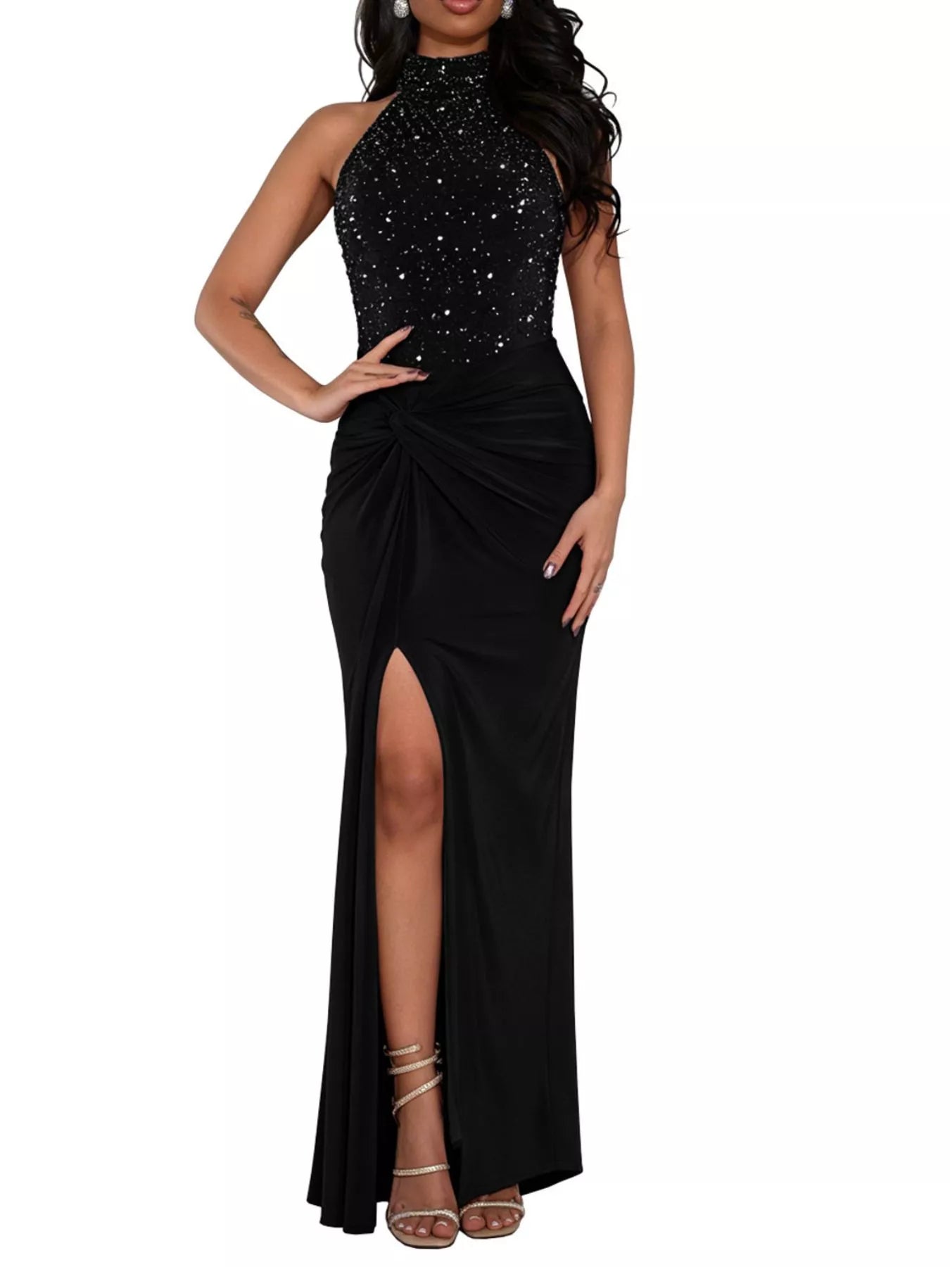 Black sleeveless maxi dress with rhinestone halter bodice twisted waist and front slit against white background