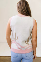 On-model back view of the cream cactus sweater vest with pink trim and wavy hem detail