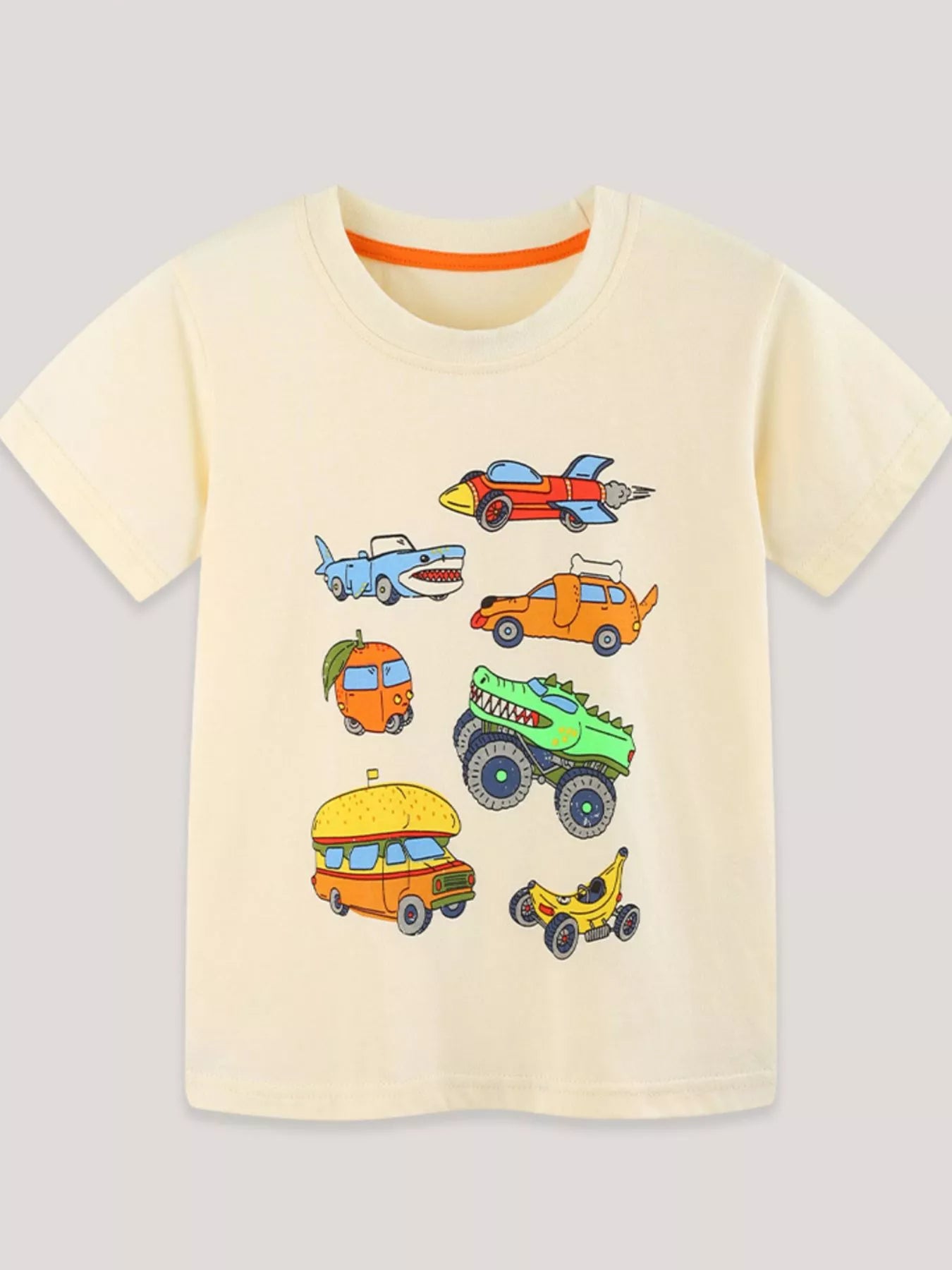 Flat front view of the cream children's tee with colorful cartoon vehicle prints