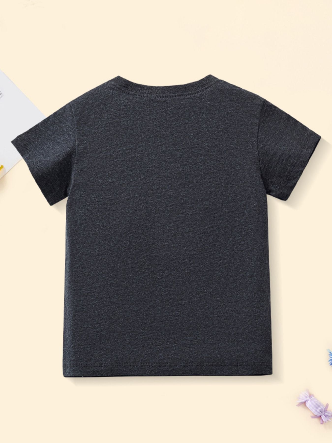 Plain back view of black children's short sleeve t-shirt with no print