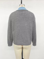 Back view of the gray contrast collar sweater displayed on a dress form