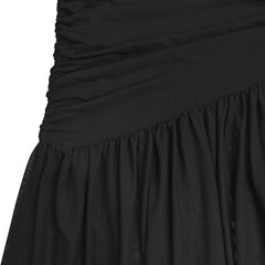 Close up of black ruched bodice joining the flowing maxi skirt at the seam