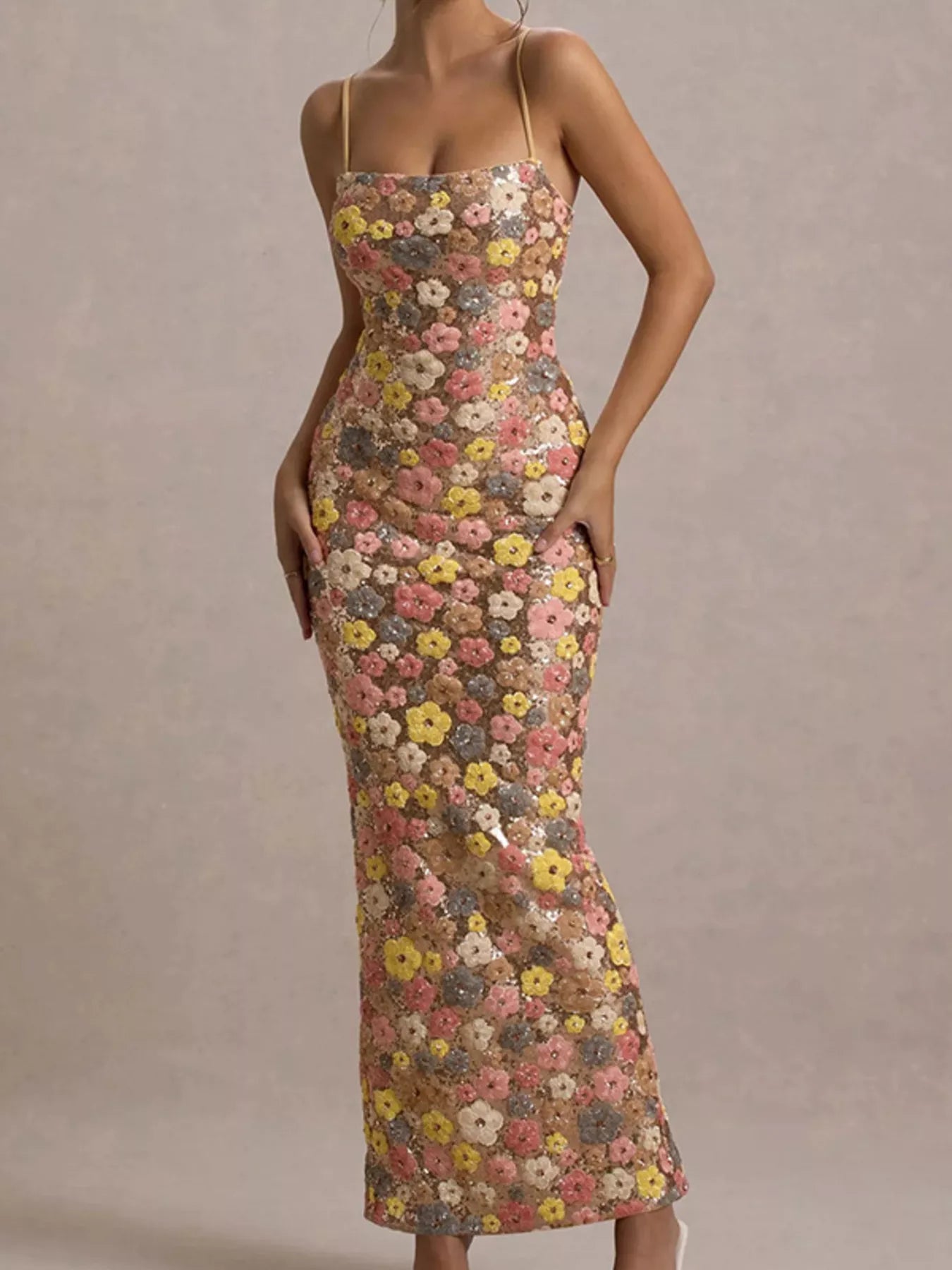 Front angled view of a multicolor floral sequin bodycon maxi dress with thin straps