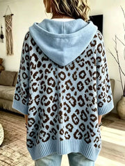 Back view of light blue leopard print oversized hooded knit sweater with solid blue hood
