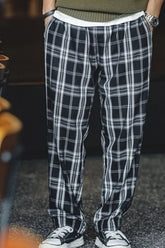 Men's black plaid casual pants, available in plus sizes.