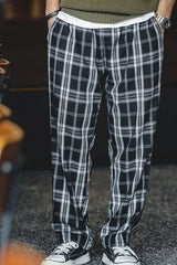 Men's black plaid casual pants, available in plus sizes.