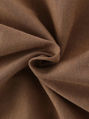 Close-up of soft folded caramel knit fabric texture of children's short sleeve t-shirt