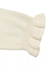Close up of cream knit top sleeve showing ruffled cuff detail flat lay