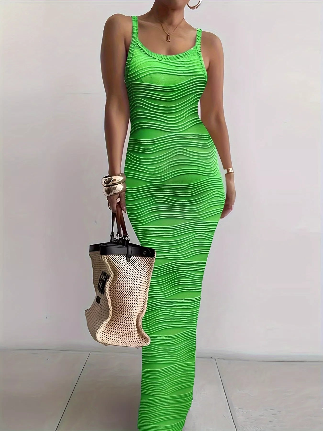 Bright green sleeveless bodycon maxi dress with wavy textured fabric worn front facing