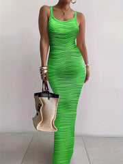 Bright green sleeveless bodycon maxi dress with wavy textured fabric worn front facing