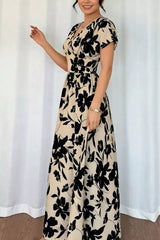 Three quarter view of khaki floral short sleeve maxi dress with V neckline and flared skirt