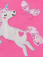 Close-up of white unicorn and floral butterfly applique on fuchsia pink children's tee