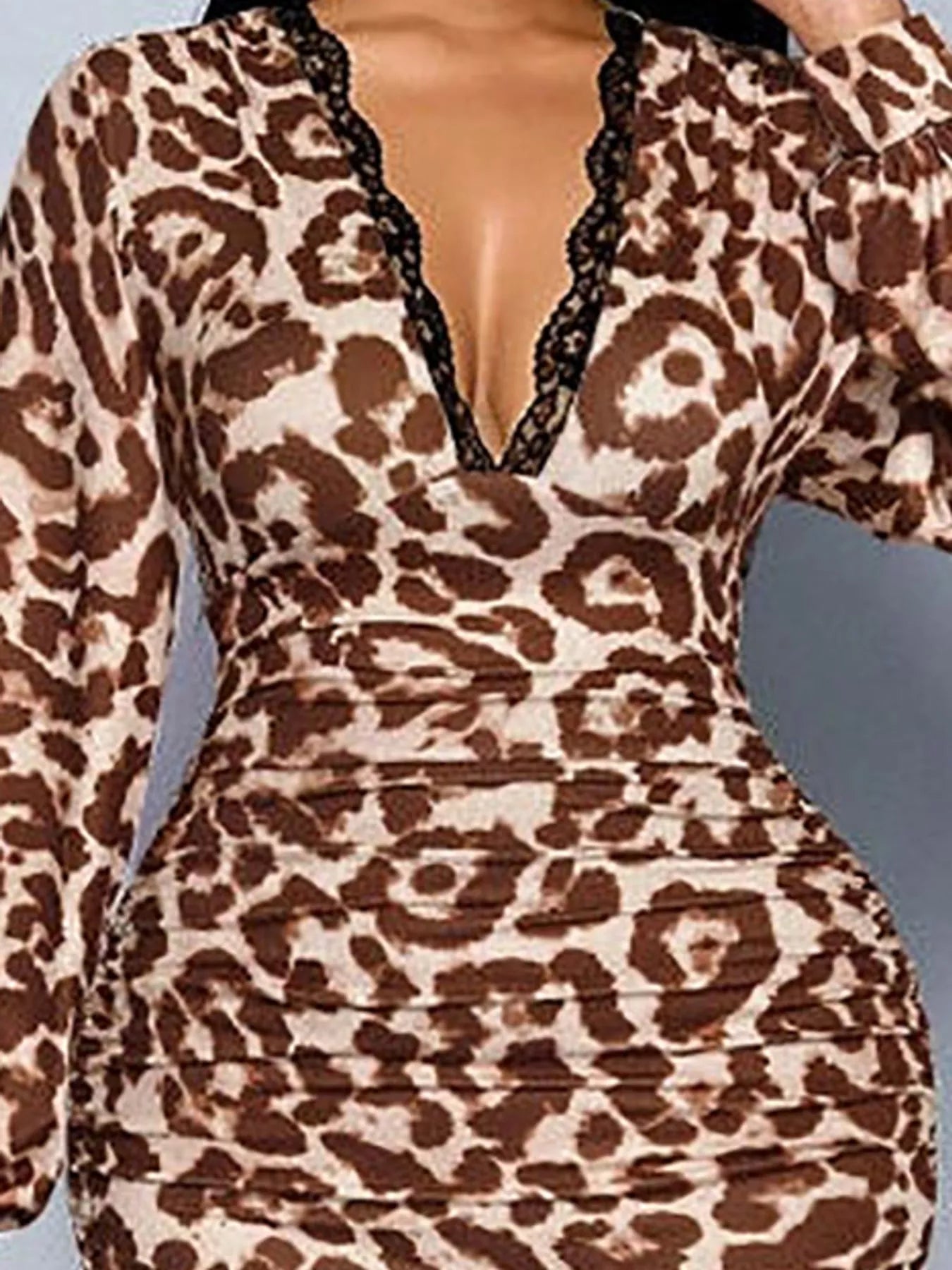 Close view of brown leopard print bodice and ruched waist from the front